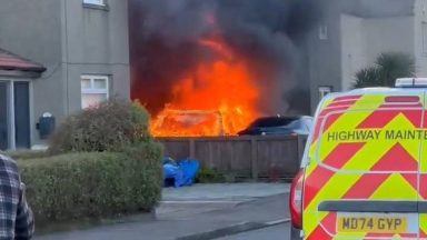 Car bursts into flames as firefighters tackle blaze outside Kirkcaldy house