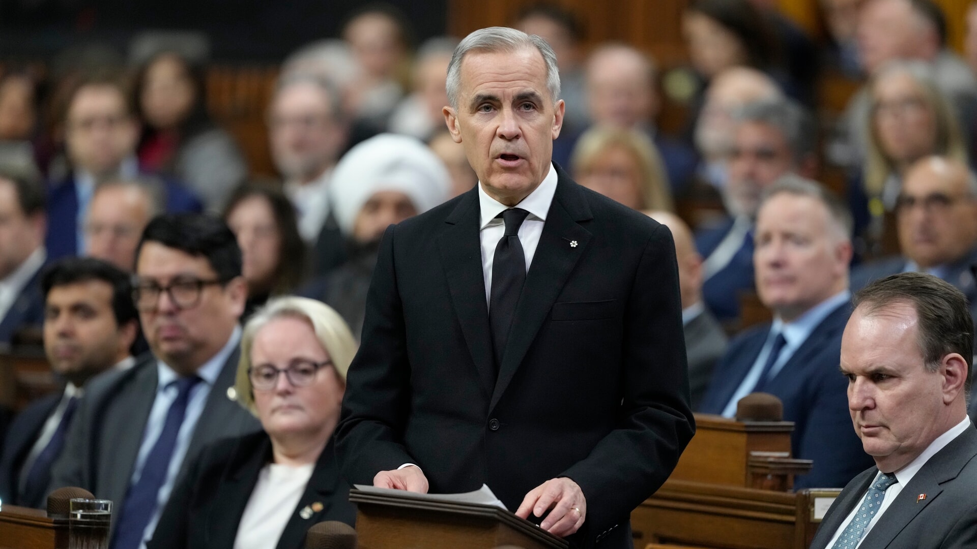 Prime Minister Mark Carney addresses politicians about the tragedy