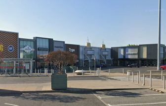 Pedestrian hit by people-carrier taxi in retail park car park amid appeal to driver