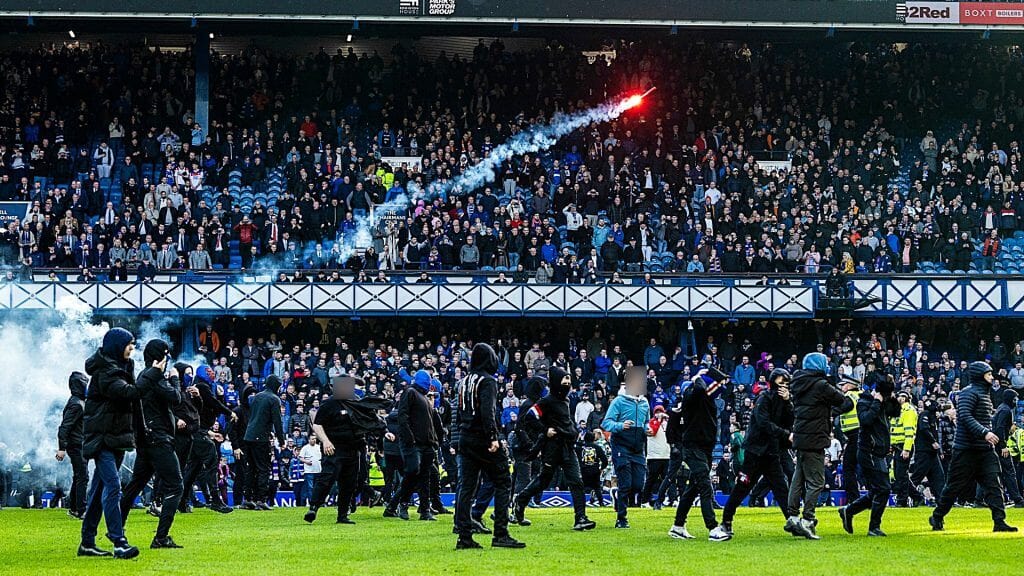 Arrests made as fans clash on Ibrox pitch after Celtic knock Rangers out of cup