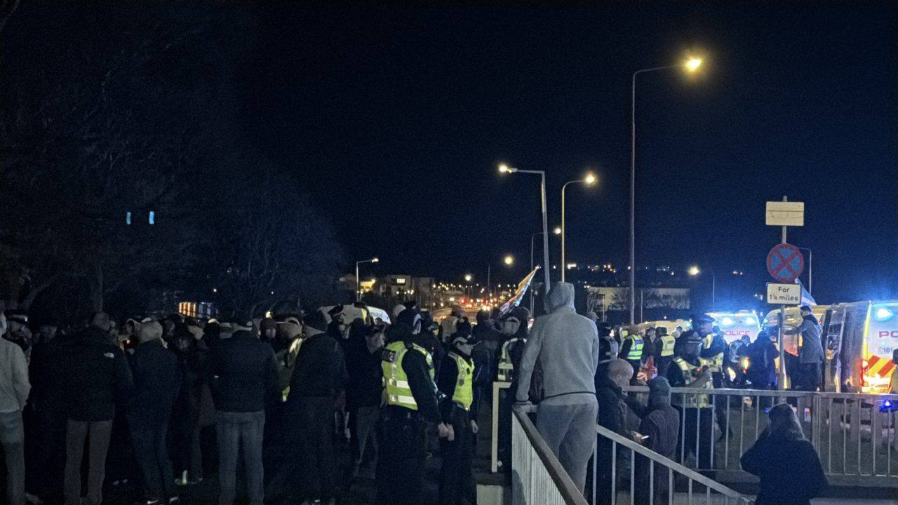 Police block road as protesters gather after Edinburgh double murder bid