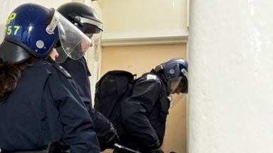 Man charged after weapons, drugs and cash seized in police raid on Easterhouse home