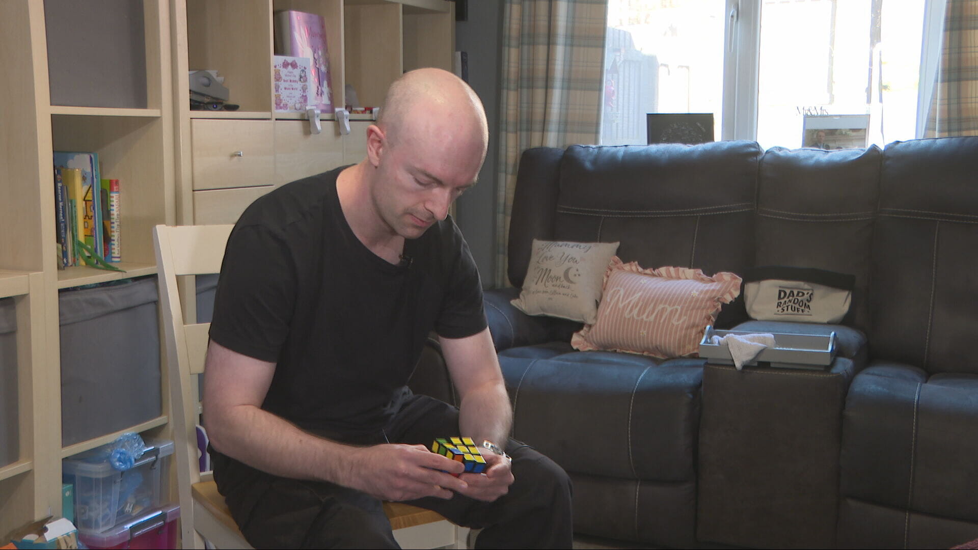 Daniel  regularly plays the Rubik's cube to maintain dexterity in his hands