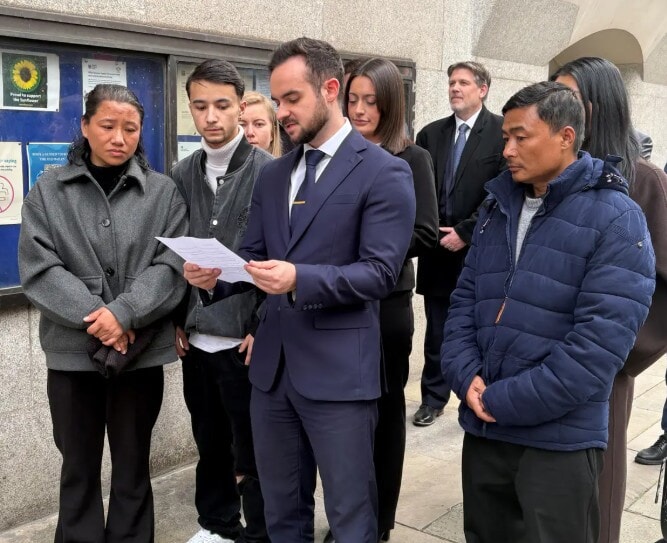 Cameron Vincent, from Leigh Day solicitors, making a statement outside the Old Bailey, London, on the behalf of parents Sharmila Tamang (far left) and Bikash Tamang (far right)