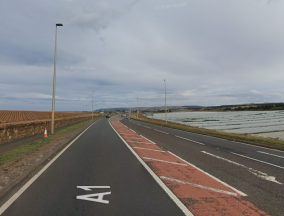 Woman dies and four others injured in two-car crash on A1
