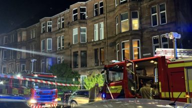 Firefighters tackle late-night Glasgow tenement flat blaze 