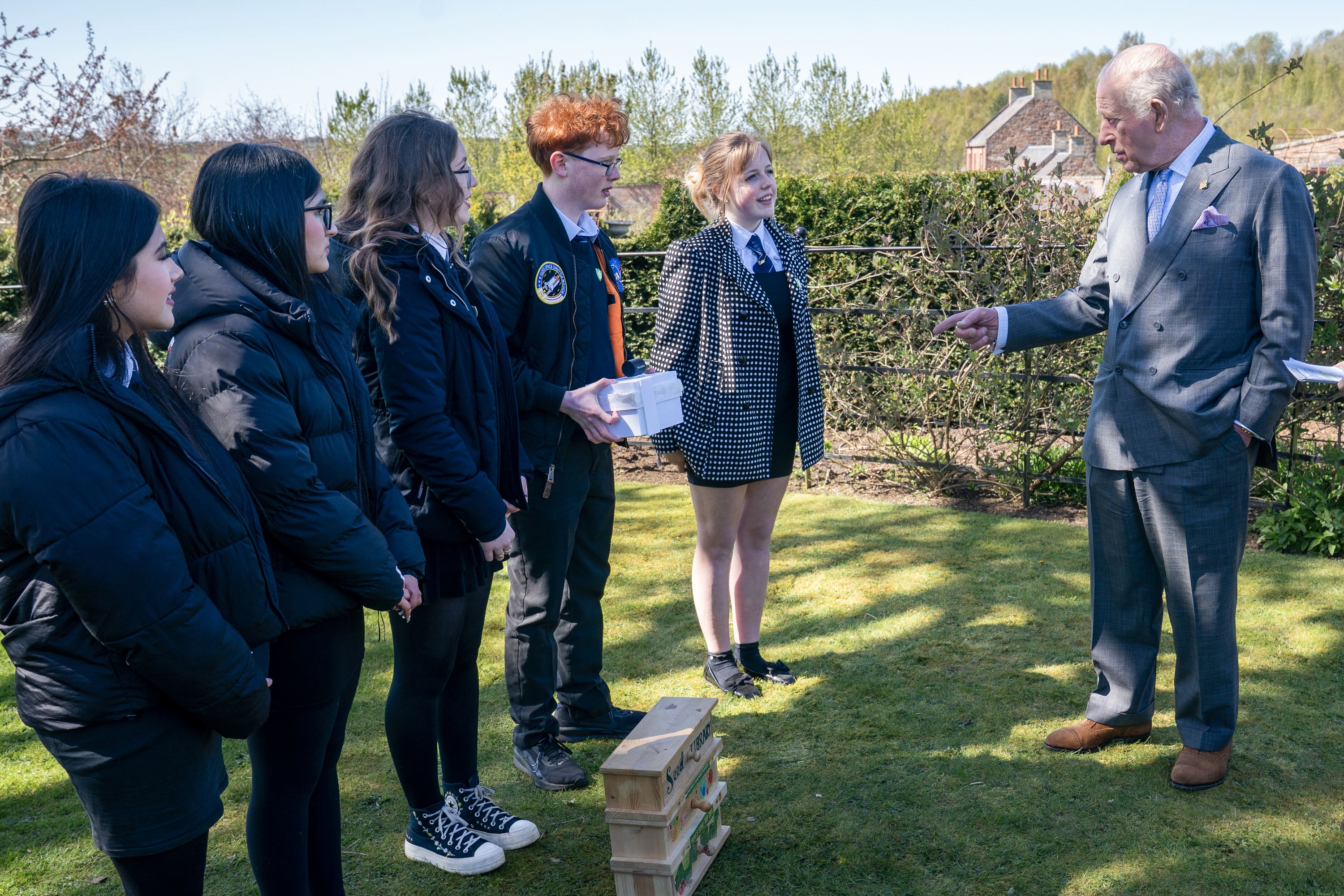 Blue Peter presenter Joel Mawhinney presented the King with the badge