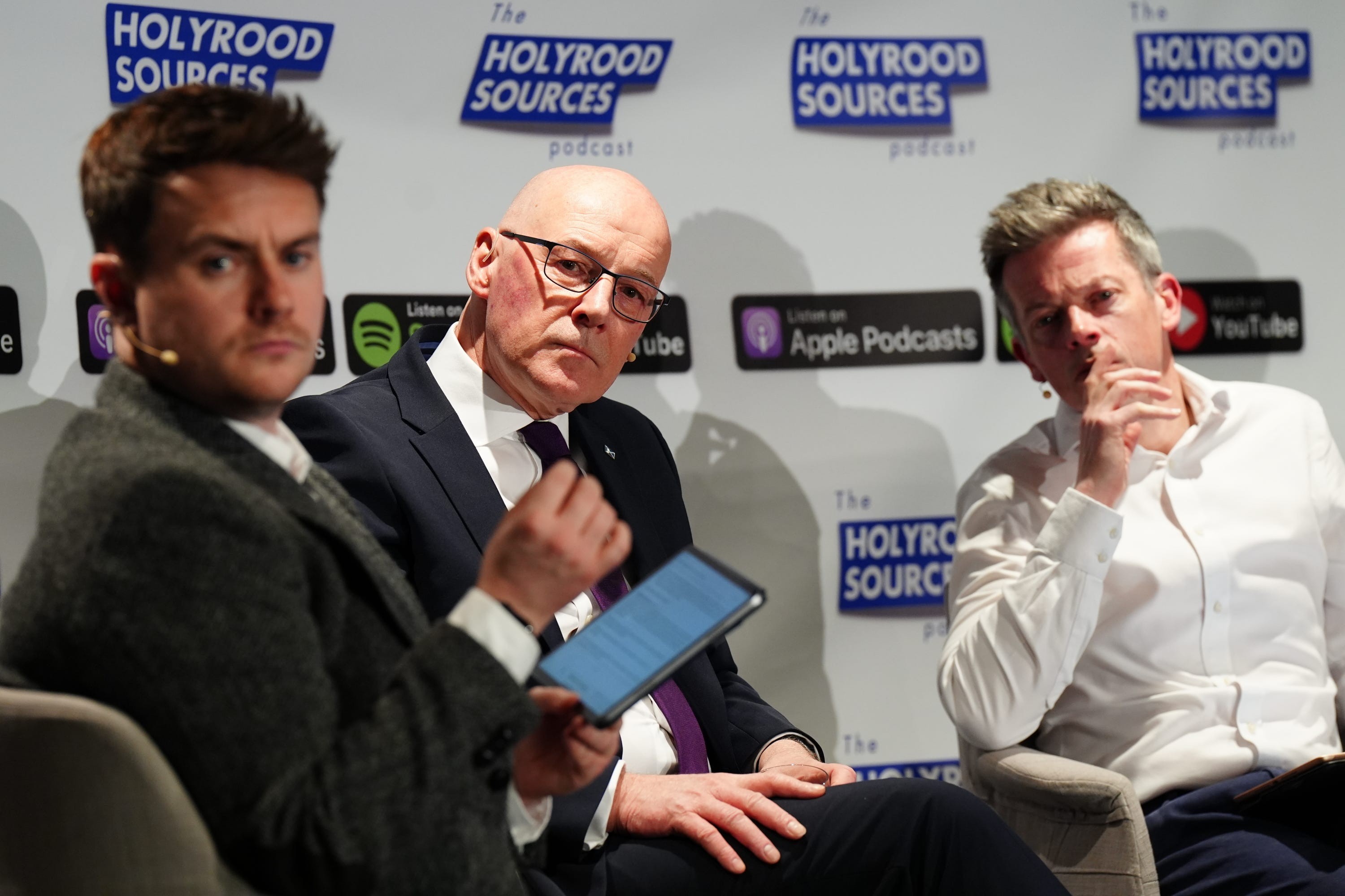 Calum Macdonald, First Minister John Swinney and former head of communications for the Scottish Conservative Party Andy Maciver taking part in the Holyrood Sources podcast