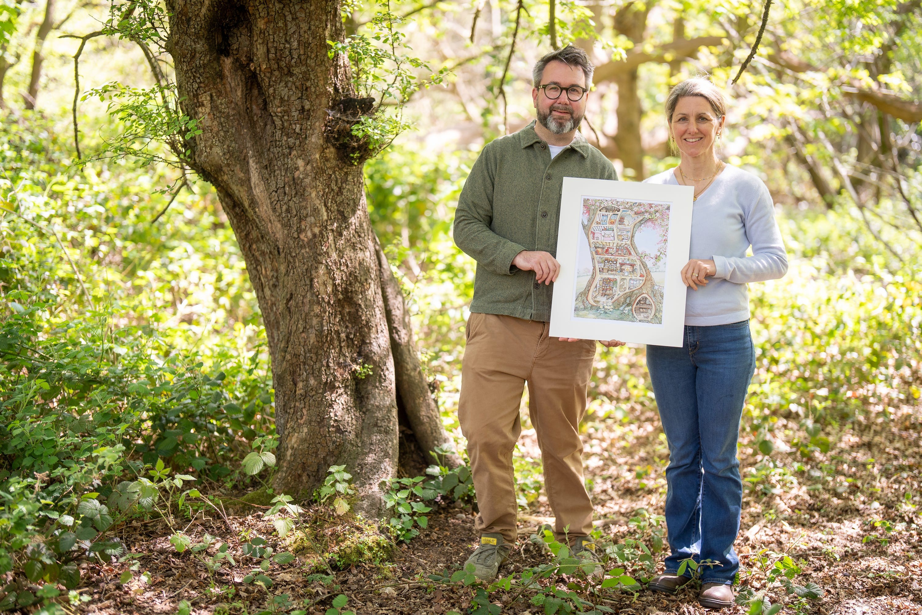 Peter and Lizzie Barklem during a visit to Epping Forest to see the crab apple tree which inspired the illustration of Crabapple Cottage