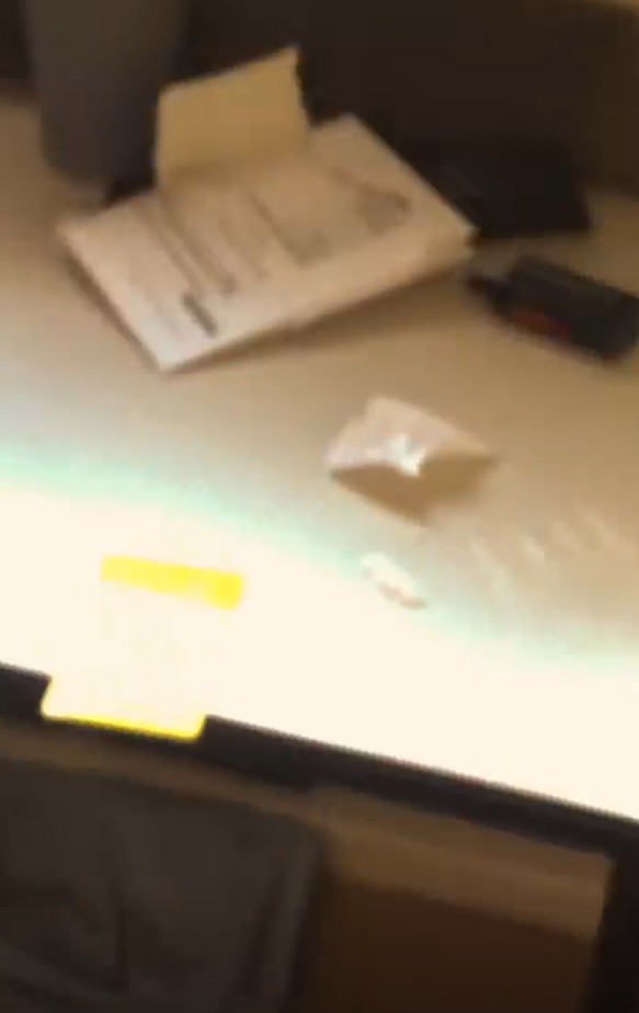 One video shows a white powdery substance on a table