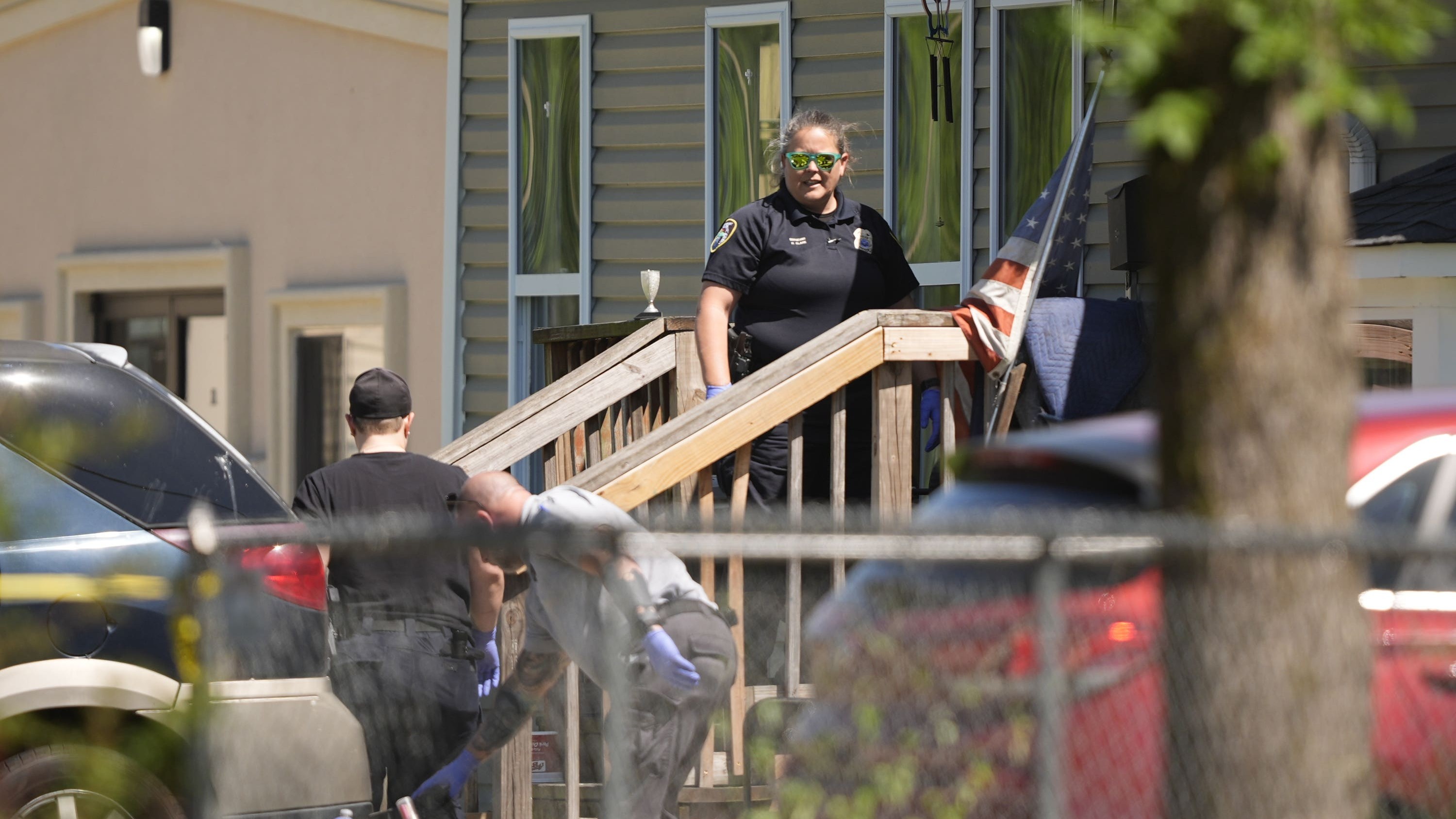 Police enter a house in Shreveport, Louisiana that is one of the locations tied to a mass shooting