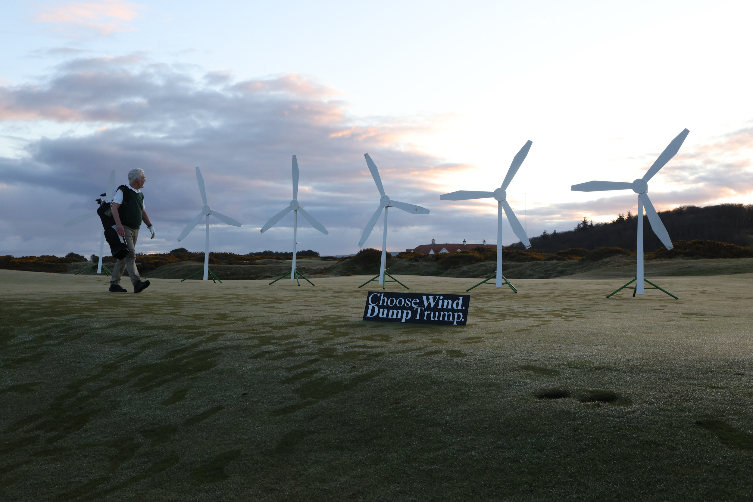 Greenpeace activists install a model wind farm on a green of the Trump Turnberry Golf Club.