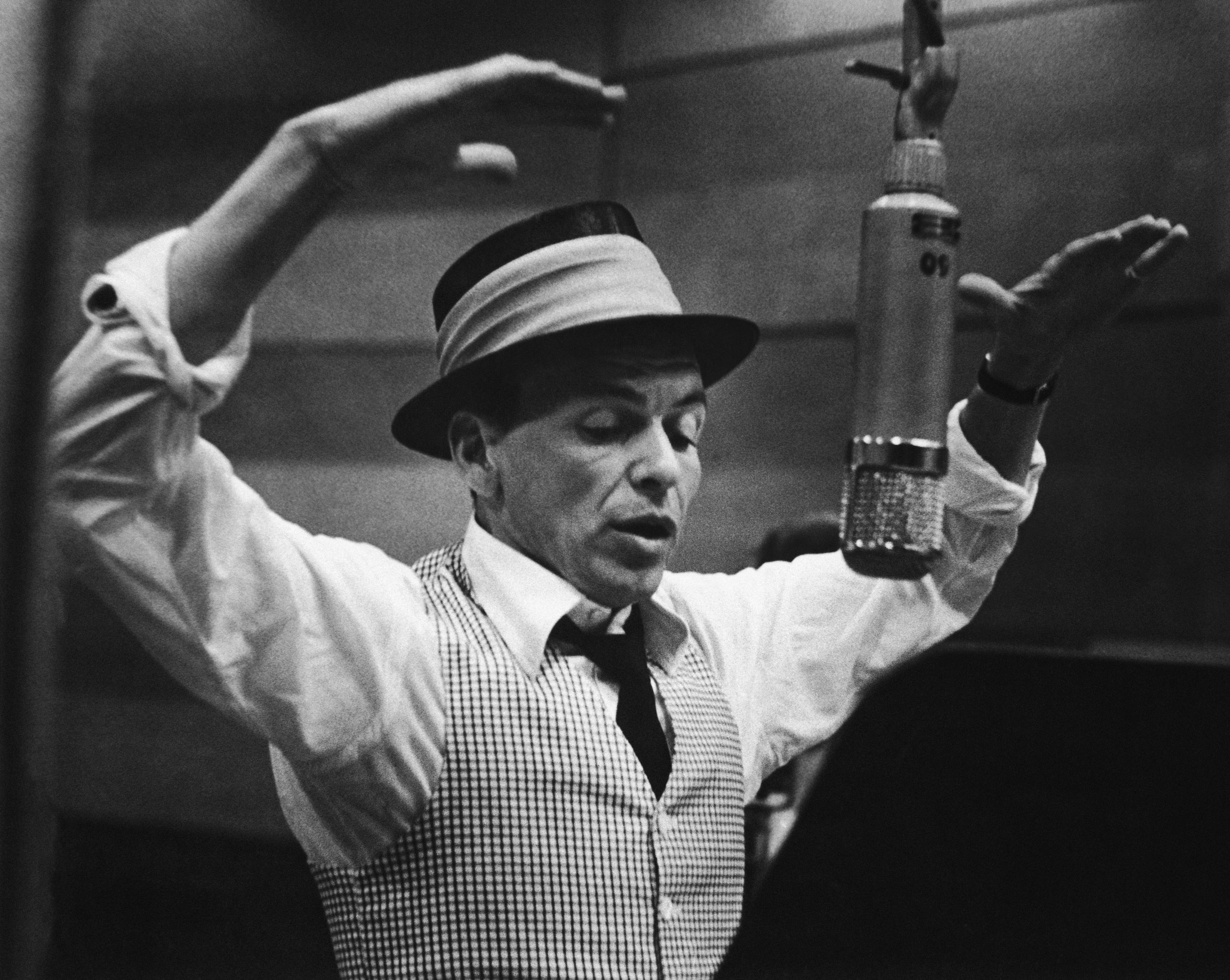Frank Sinatra singing during a recording session at Capitol Records