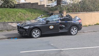 Roof of taxi cut off and woman in hospital following Glasgow crash
