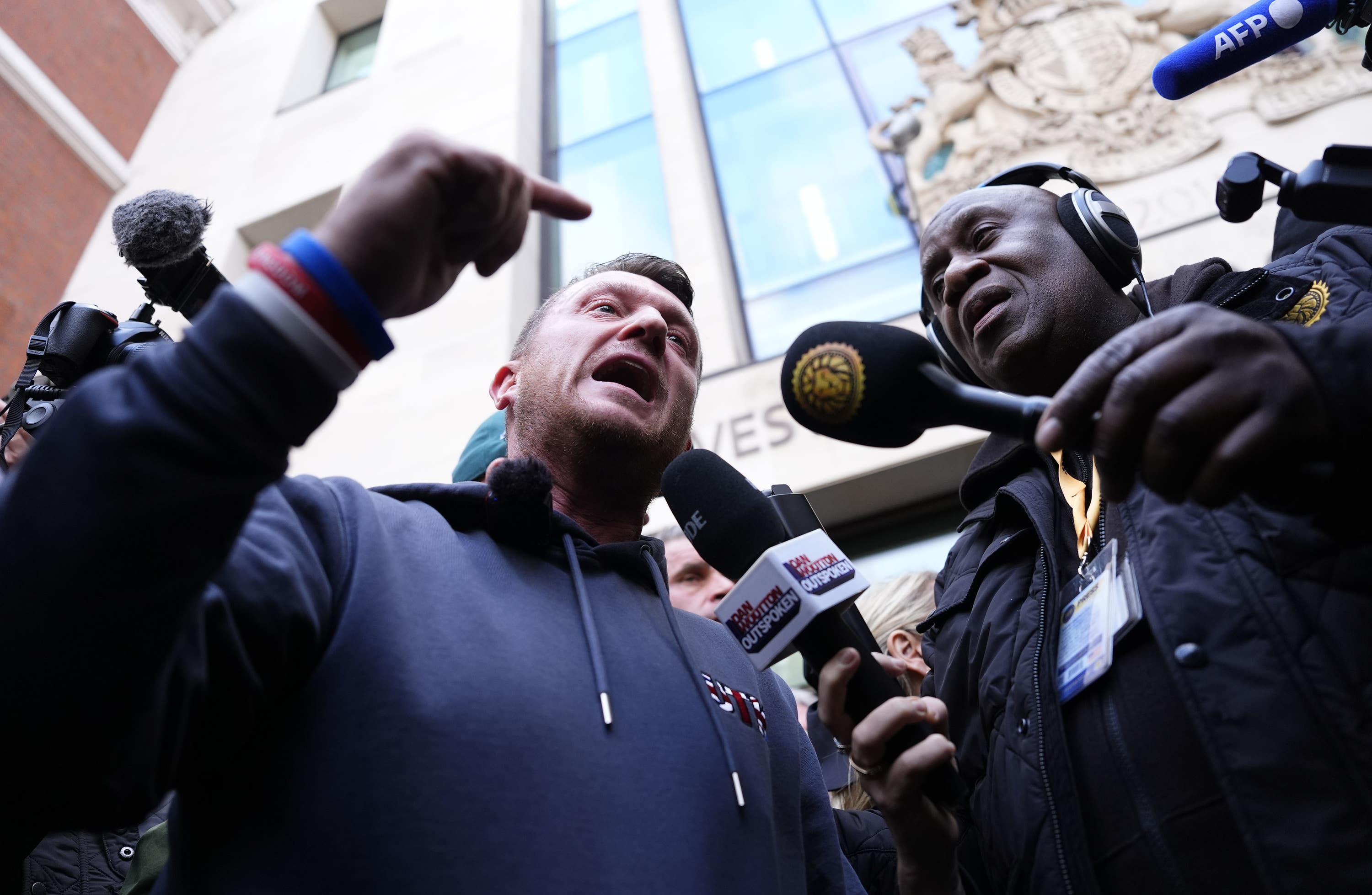Tommy Robinson speaks to the media following a court appearance (Jordan Pettitt/PA)