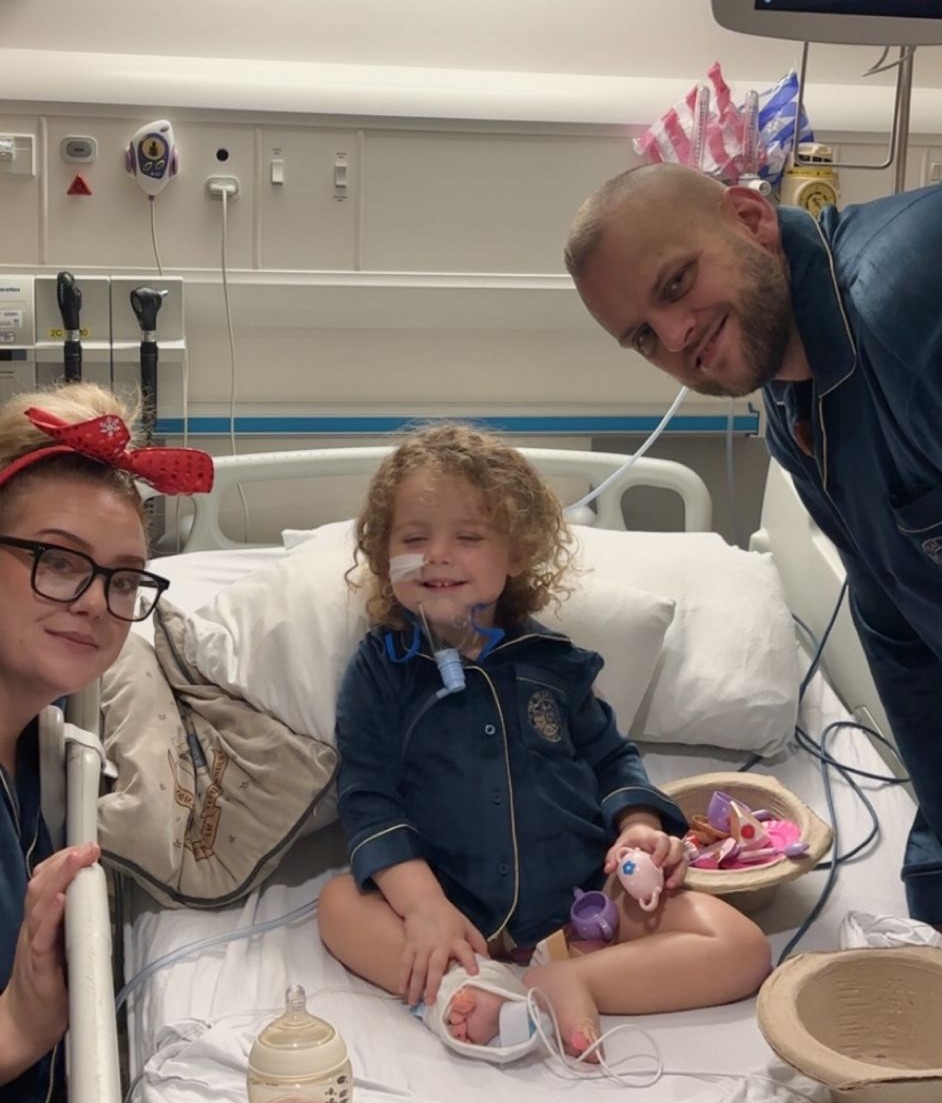 Grayce with her parents, Tony and Carrie.