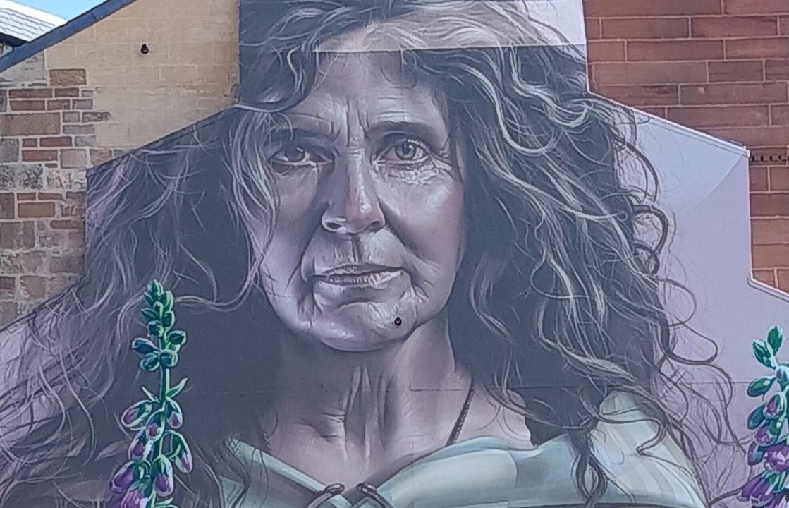 Australian artist transforms Glasgow city centre tenement with huge mural of mother of St Mungo