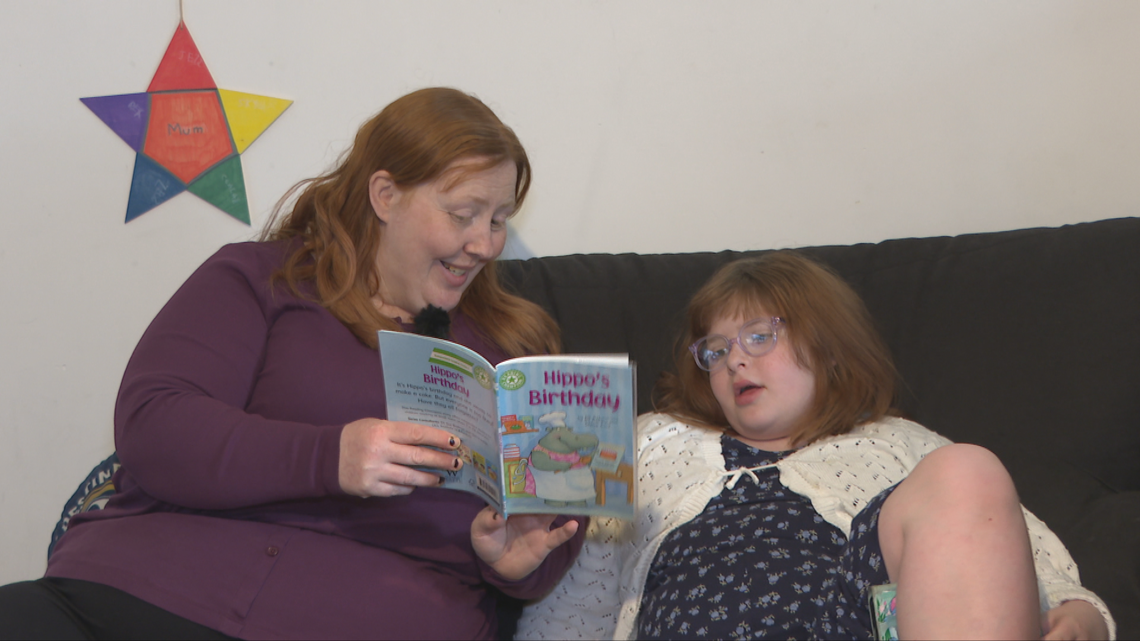 Claire reads to her daughter Skyla