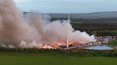Firefighters work through second night tackling waste facility blaze