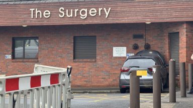 GP surgery and pharmacy evacuated after car crashes into building