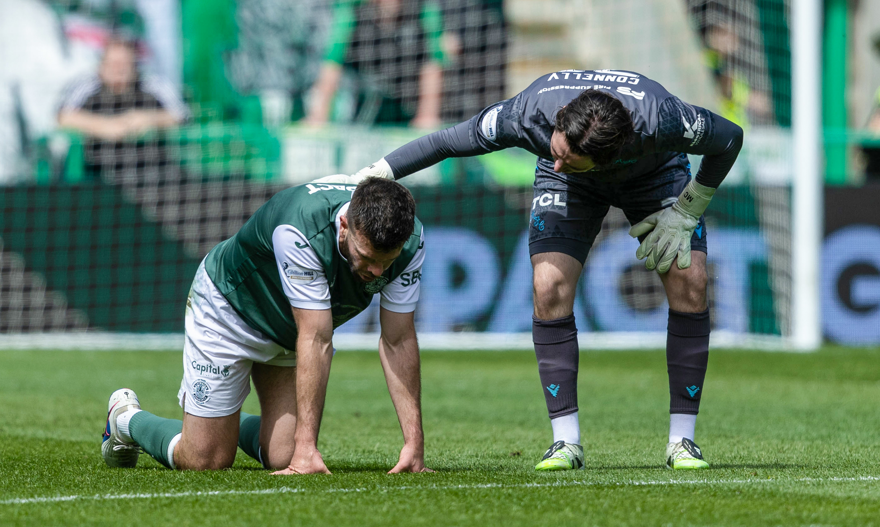 Hibernian's Grant Hanley looks dejected after going down injured