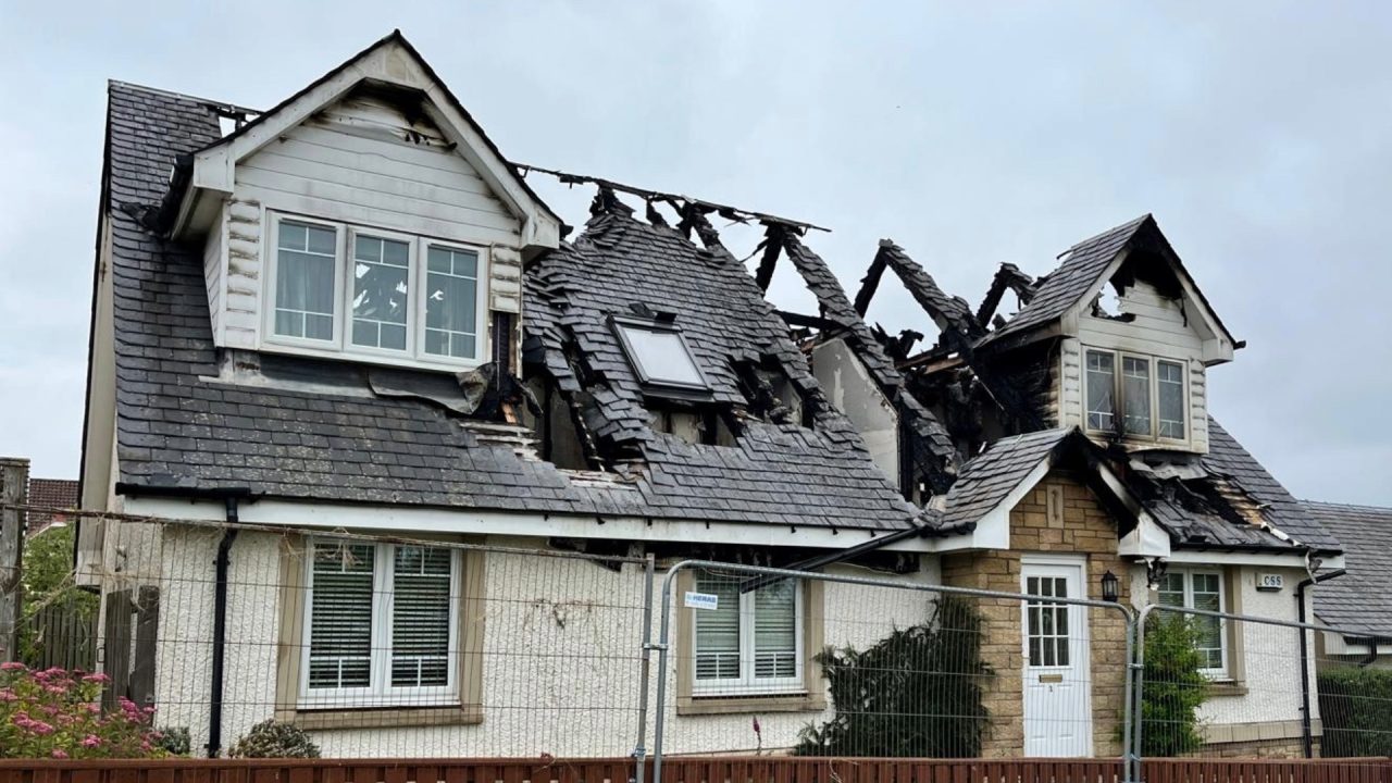 Firefighters tackle house fire through night during thunderstorm 