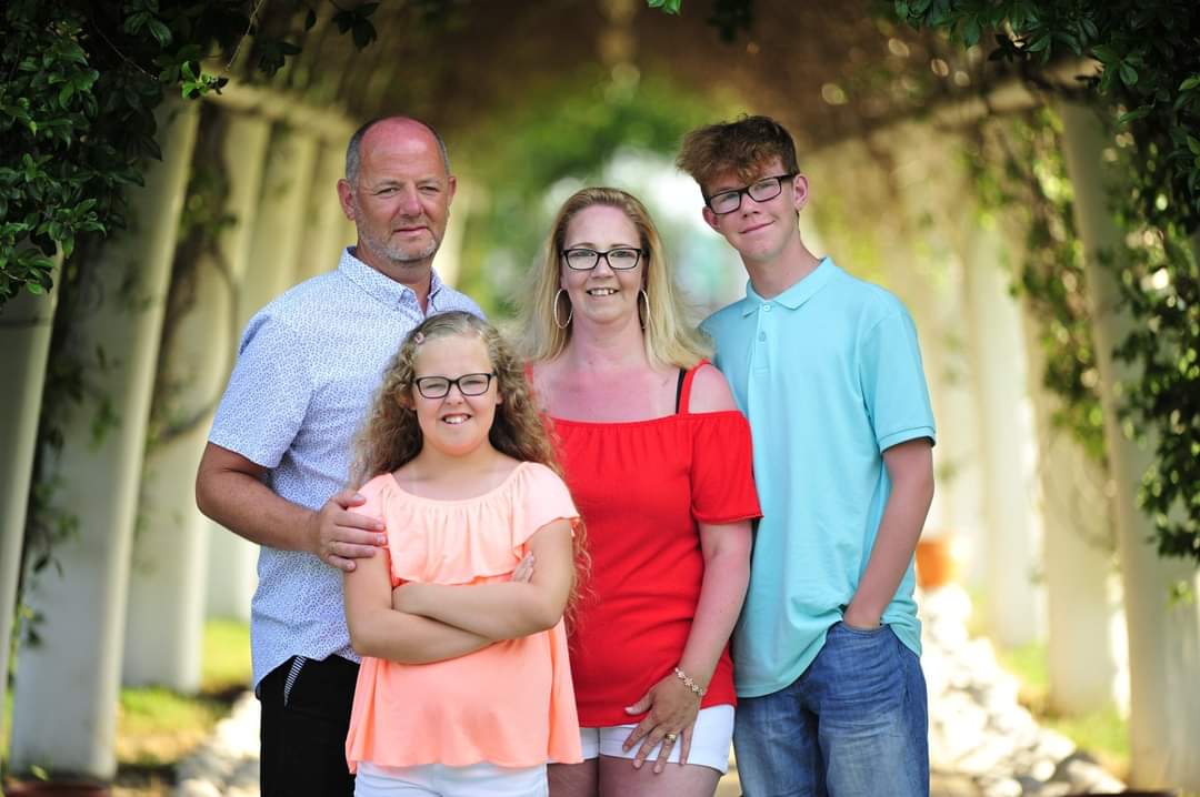 Courtney with her parents and her brother Shaun