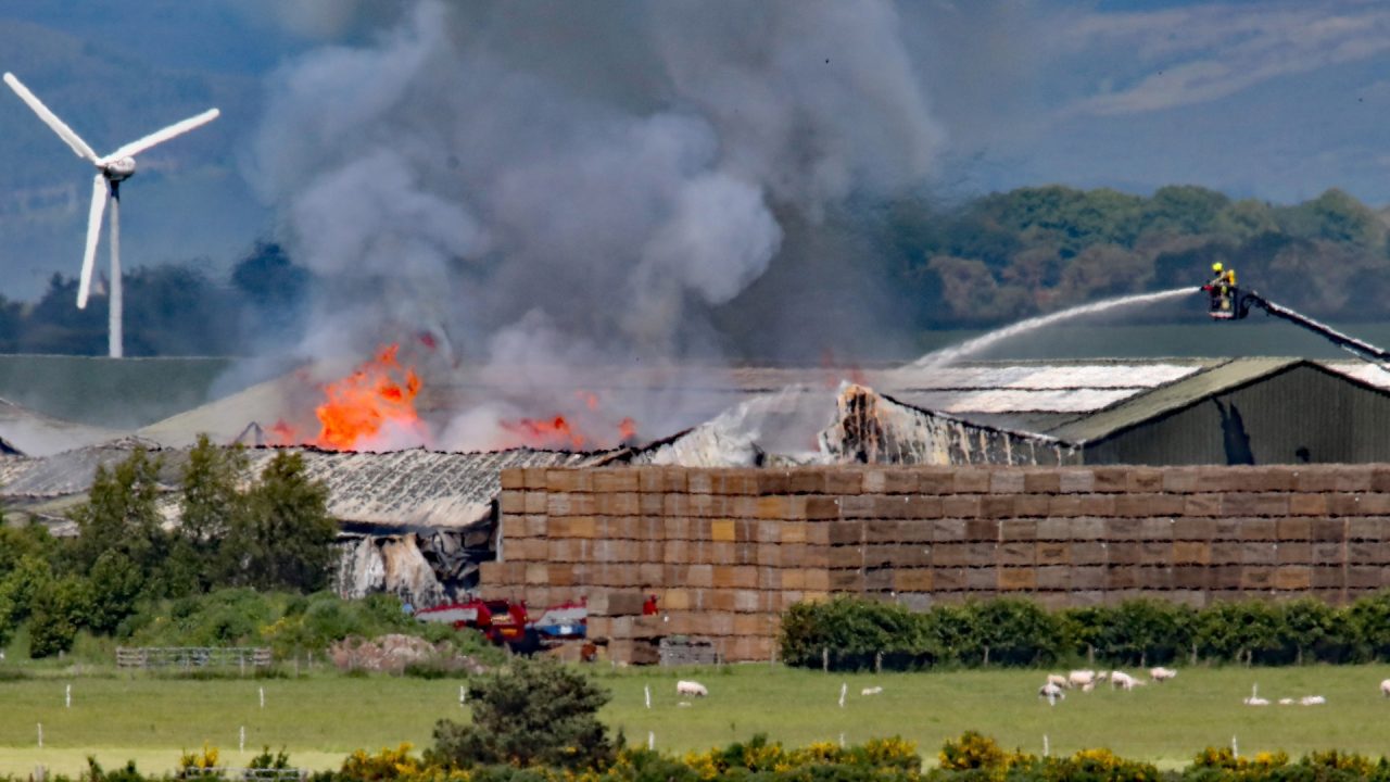 Firefighters battling blaze at farm building near Highland airfield