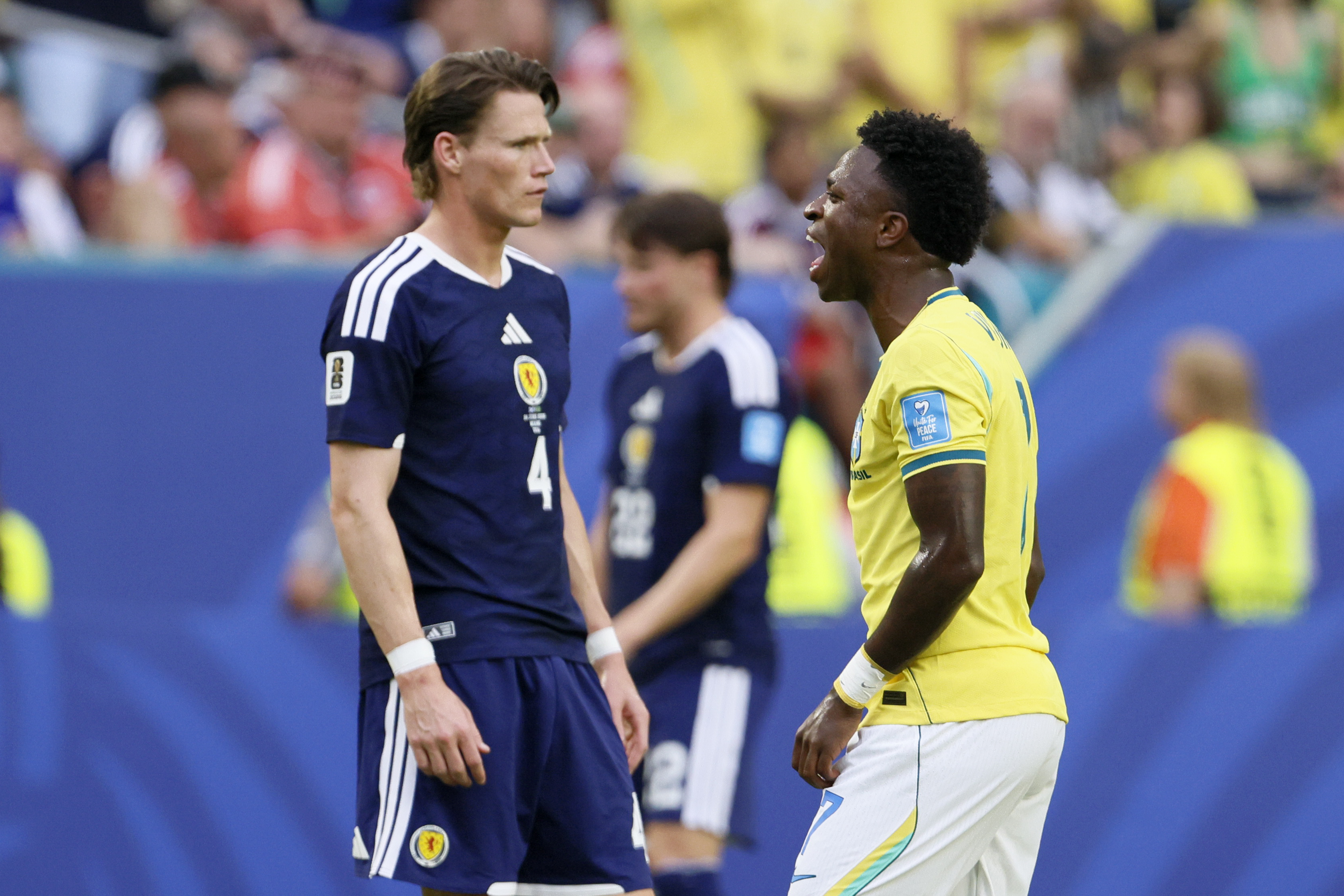 Scott McTominay and Vinicius Junior of Brazil.