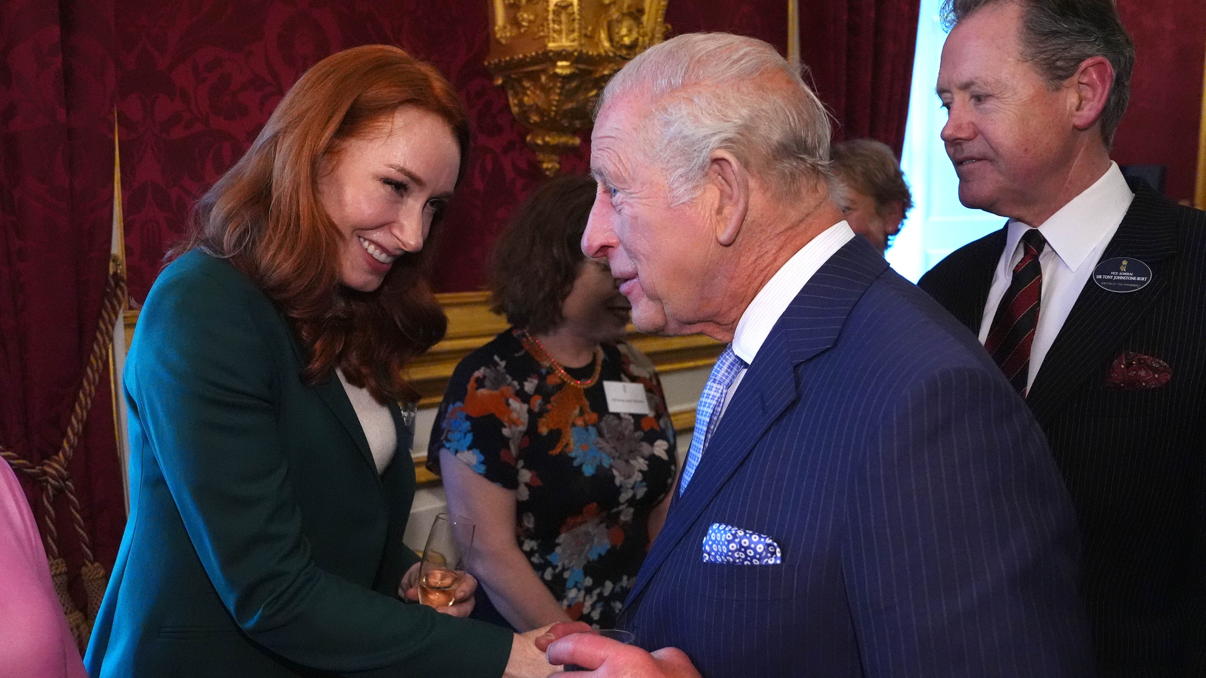 King Charles III speaks to Hannah Fry during a Cancer Research UK reception to mark the charity's 125th anniversary, at St James's Palace, London