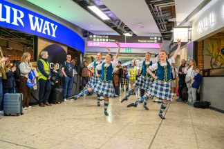 World Cup-bound Scots given rousing send-off at Edinburgh Airport by Royal Edinburgh Military Tattoo