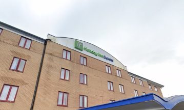 Woman in court charged with hate crime after protest at asylum hotel in Greenock