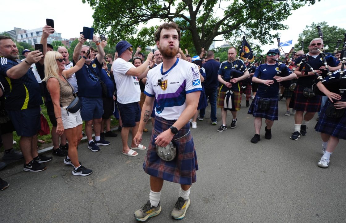 Tartan Army fan who raised £1m for charity in 3,000-mile US walk returns home