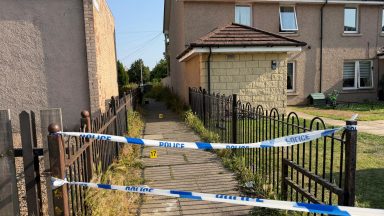 Man found seriously injured in Edinburgh stairwell as police hunt attacker 