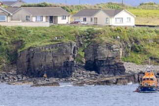Injured puppy rescued from Wick cliff after owner becomes stranded trying to help
