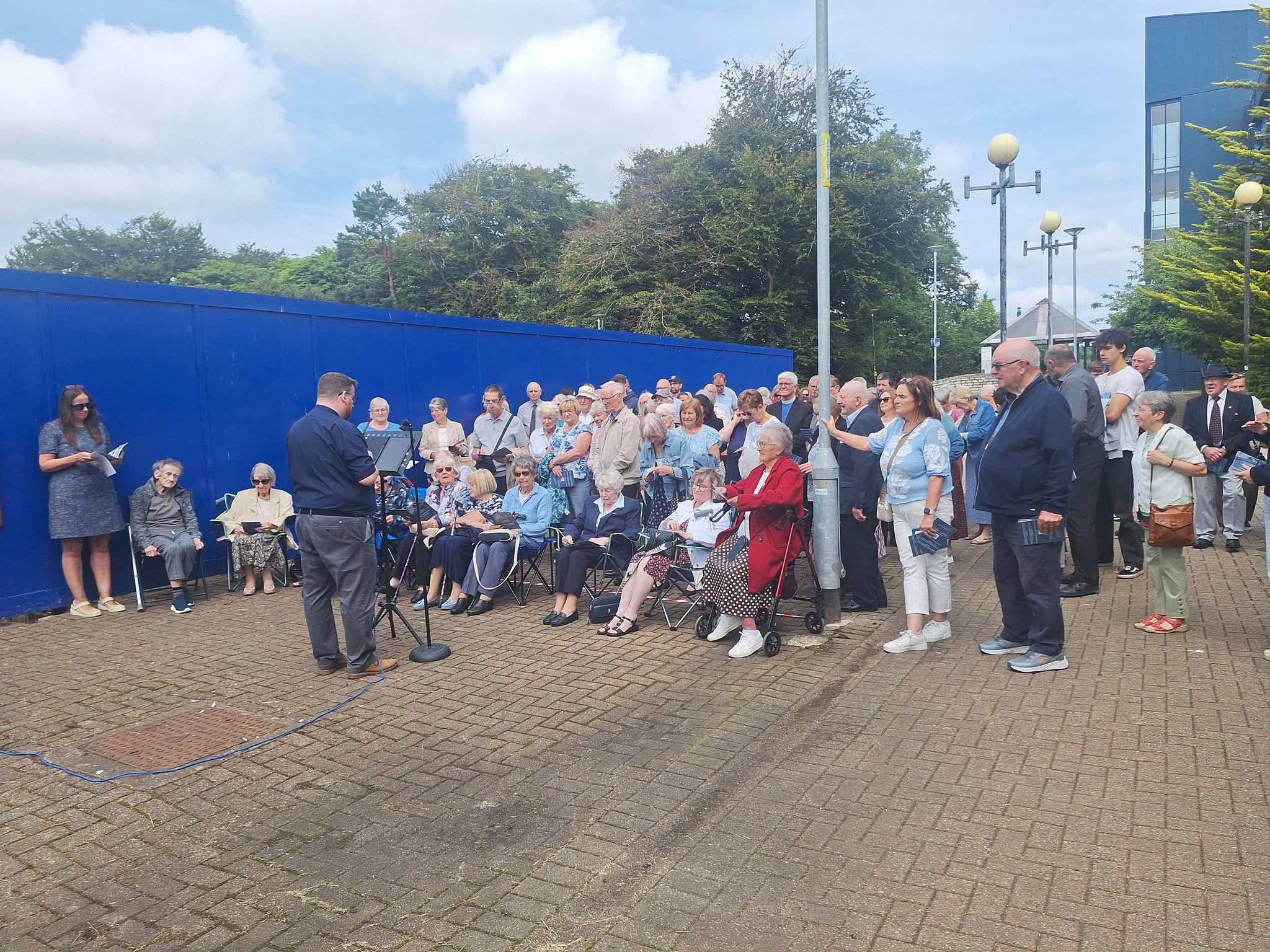 Parishioners stood outside the site where the church once stood.