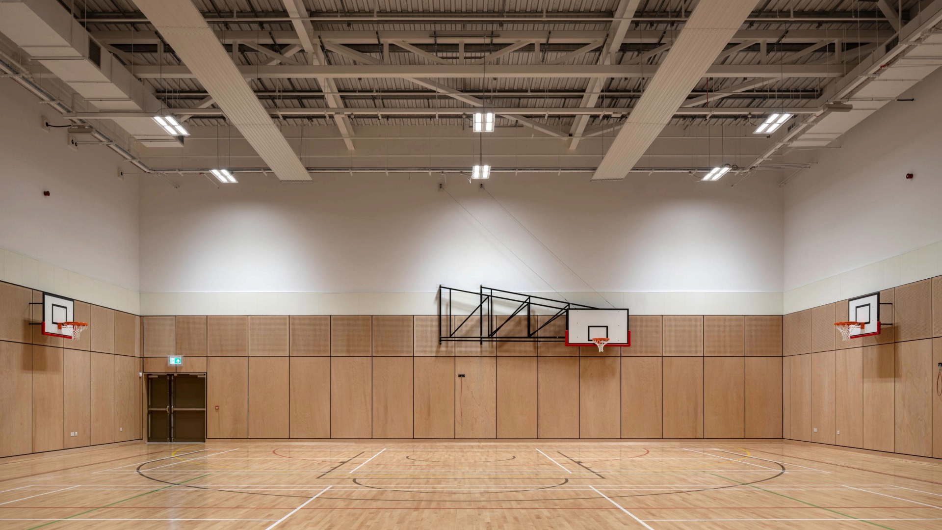 Four court games hall with timber sprung floor.