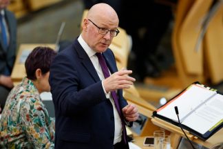 Domestic abusers on bail to be GPS-tracked from next year, Swinney announces