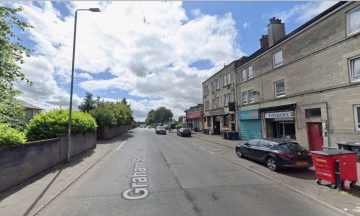Man in hospital after falling from window ‘trying to escape from armed suspects’