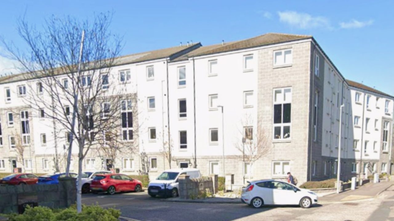 Man and woman taken to hospital after being found unresponsive at Aberdeen flat block